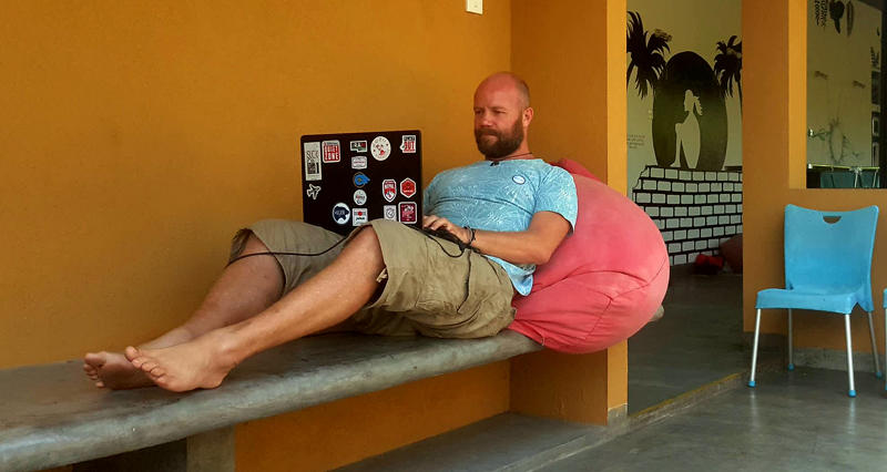 Ramon remotely working from the hostel's wifi in Sri Lanka